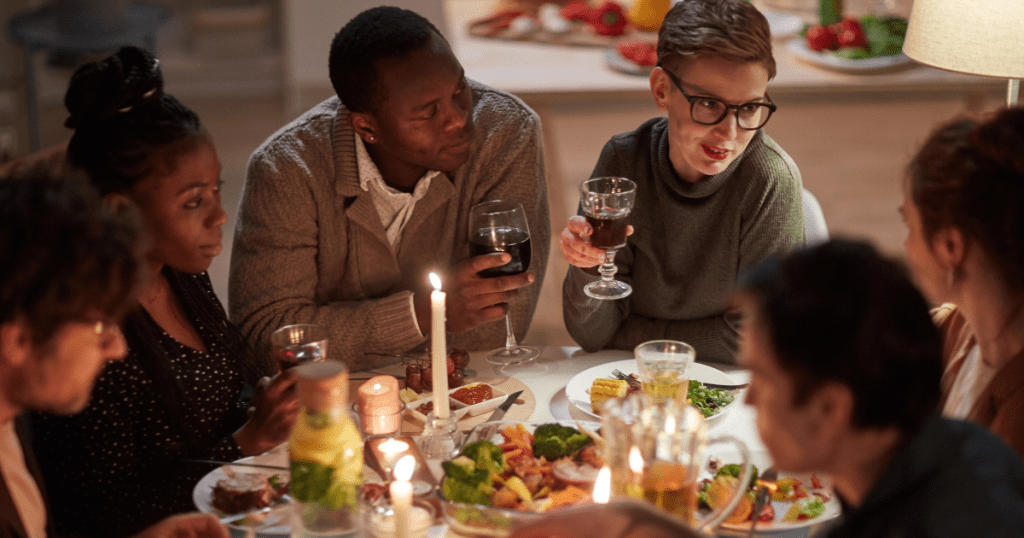 group of friends around the dining table for holiday meal