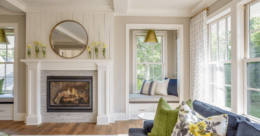 Cozy living room remodel with fireplace and custom window seating, inspired by design-build renovations in Rockford, IL and Lake Geneva, WI.