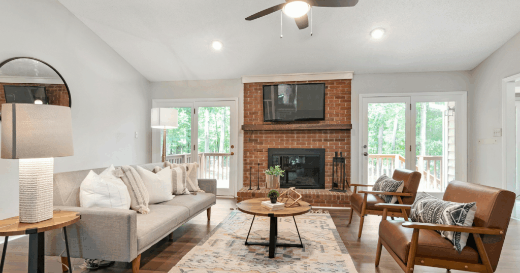 Updated living room remodel with brick fireplace and open layout, inspired by custom home renovations in Rockford, IL and Lake Geneva, WI.